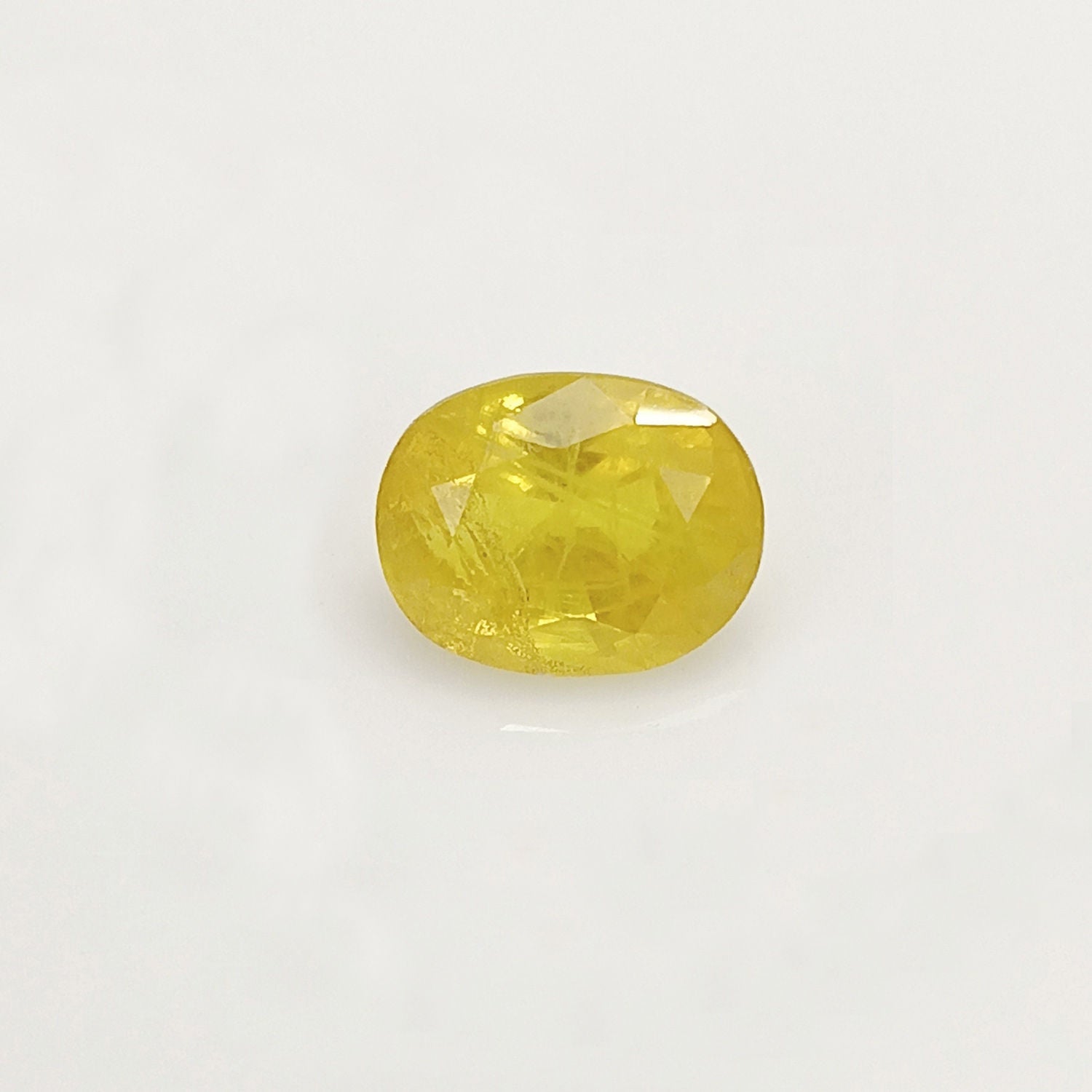 Natural Yellow Sapphire (Nigeria) (Heated) Oval Faceted (5.73 Cts. / 6.25 Ratti)