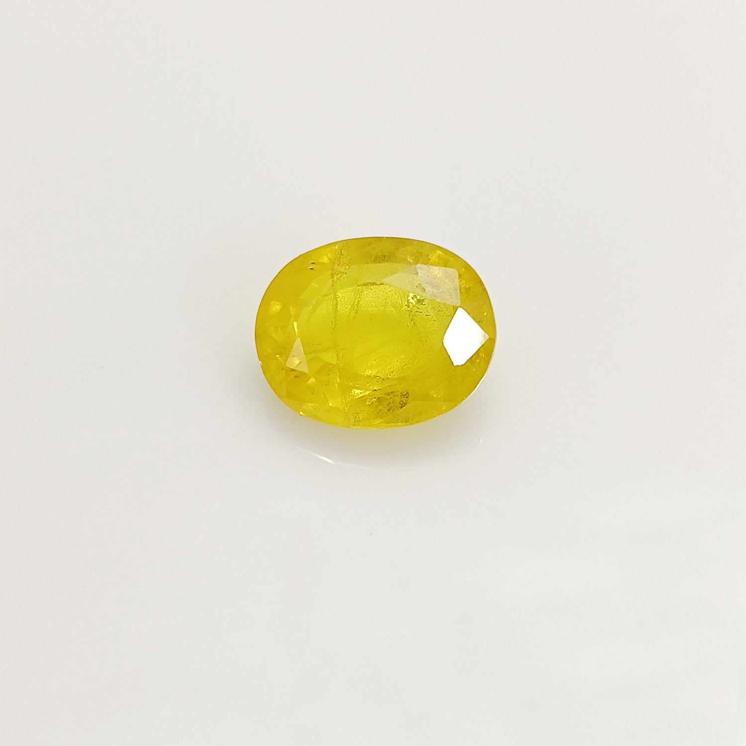 Natural Yellow Sapphire (Nigeria) (Heated) Oval Faceted (5.78 Cts. / 6.25 Ratti)